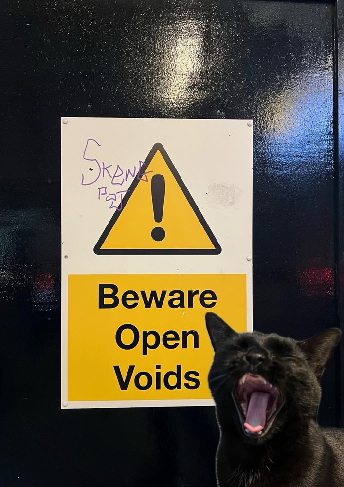 A terrifying yawn from Neil is overlaid on a picture of a “Beware Open Voids” sign.