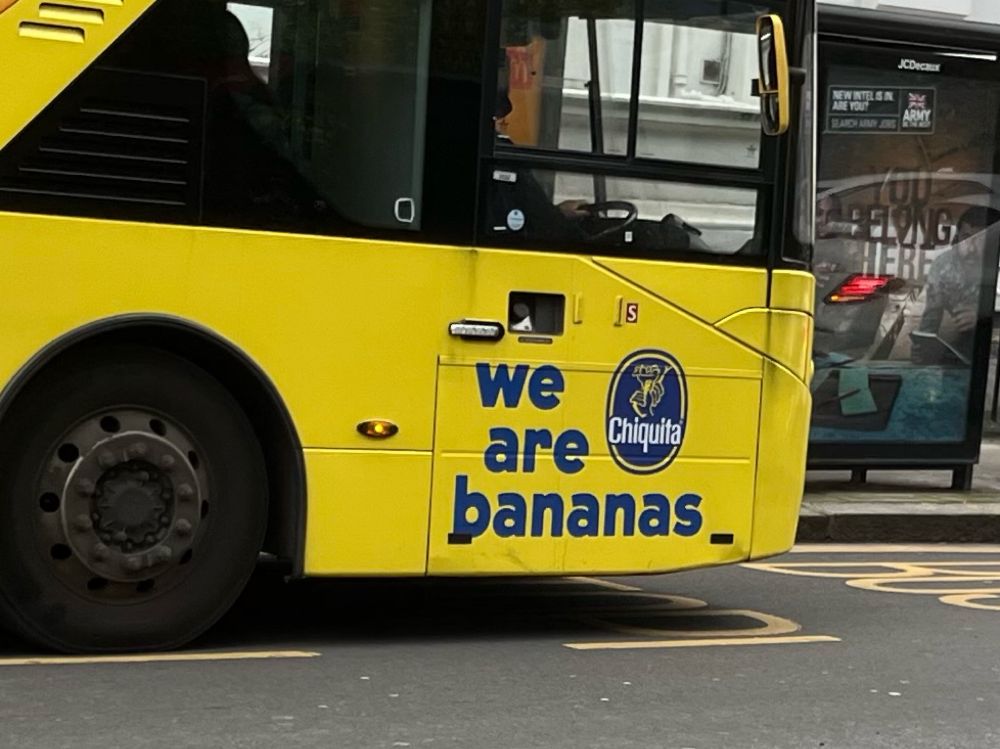 the side of a bus reading “we are bananas”