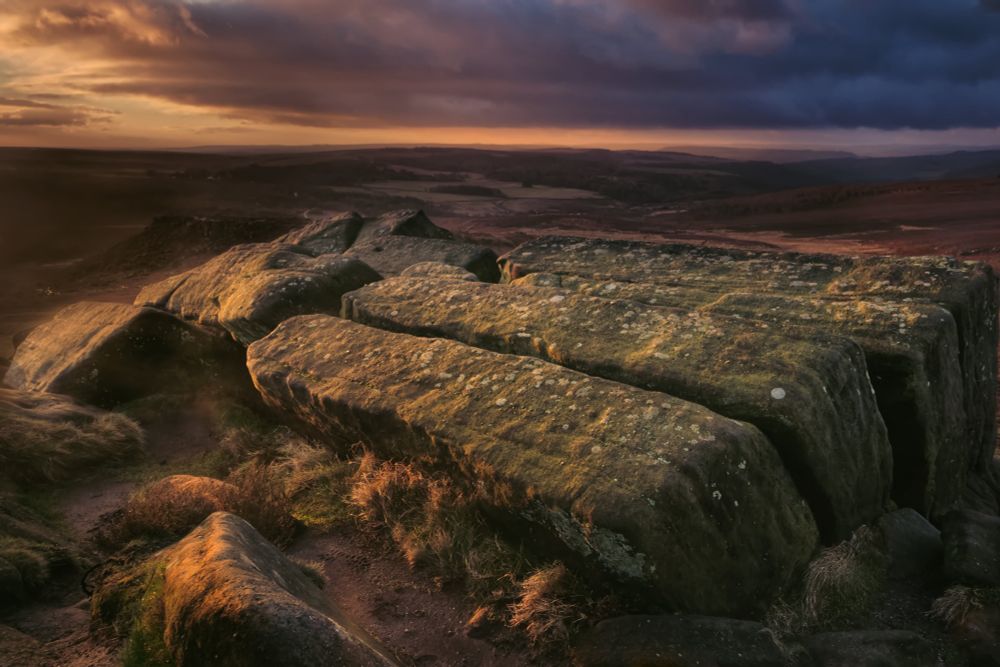 A sunlit view over the KitKat stones on Higger Tor in the Derbyshire Peak District.
