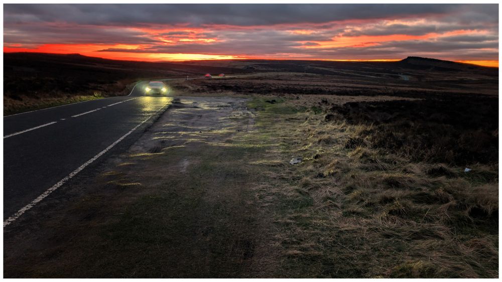 Sunset skies beyond Stanage Edge in the Derbyshire Peak District.