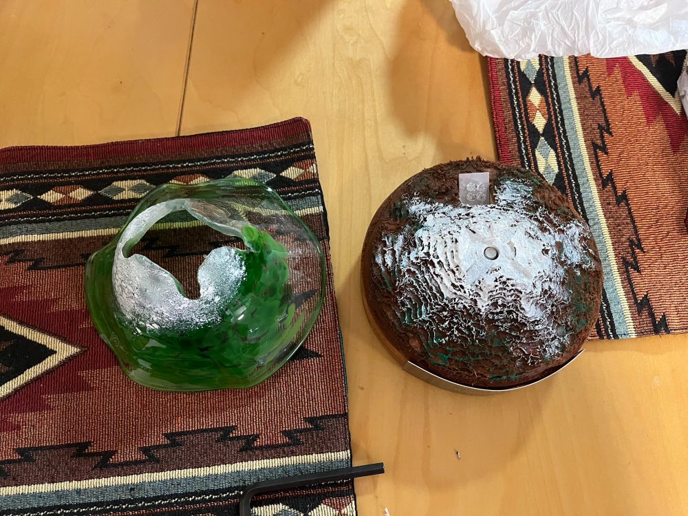 The wooden and glass components of the base of the 2025 Hugo award