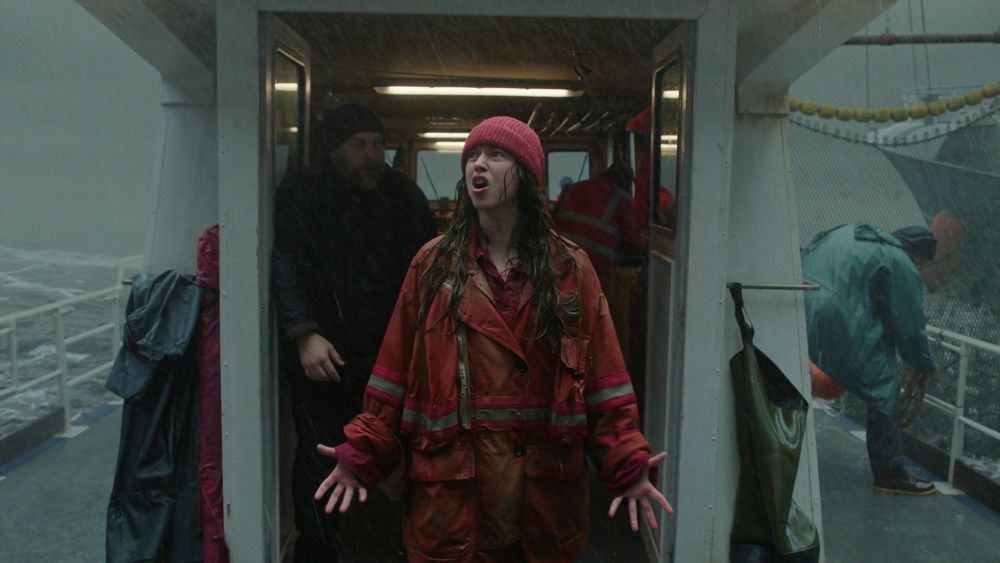 Screenshot from the Prime show Étoile featuring Lou de Laâge as prima ballerina Cheyenne Toussaint, on a boat attempting to prevent illegal fishing