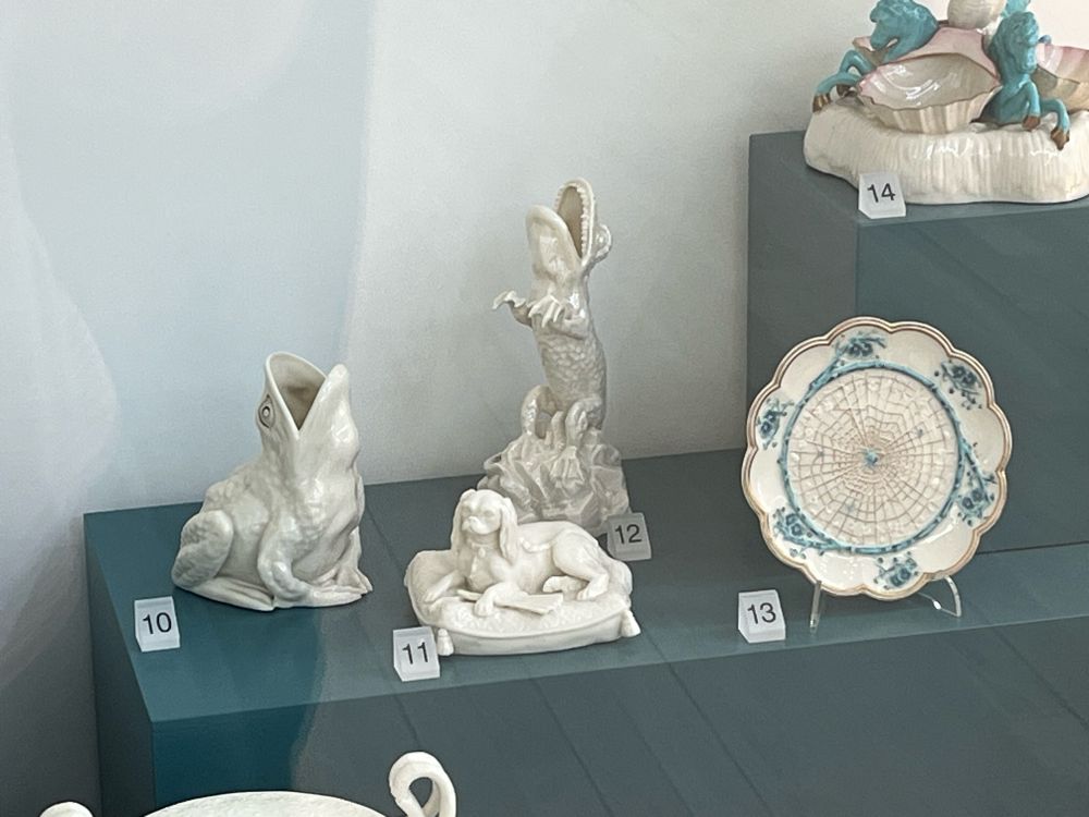 Ceramics in the Ulster museum, including frog and crocodile vases.