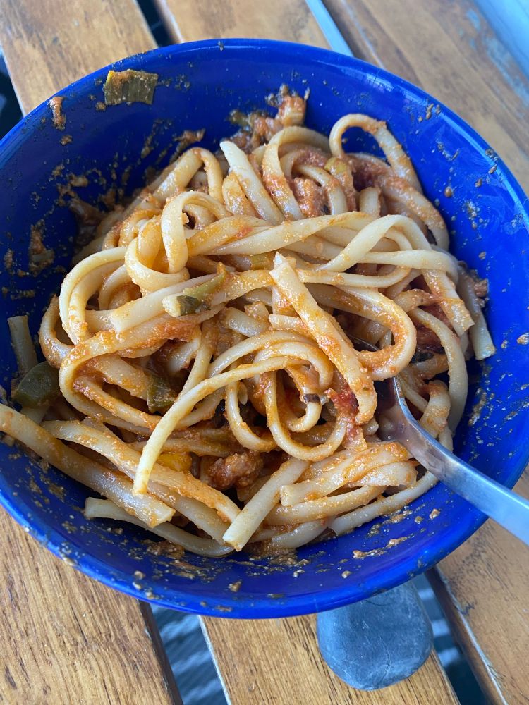 Bowl of noodles in a marinara sauce mixed with sour cream and Parmesan. Chopped some mushrooms, scallions and a green Pepper. Prosciutto was used for flavor and protein zip. 