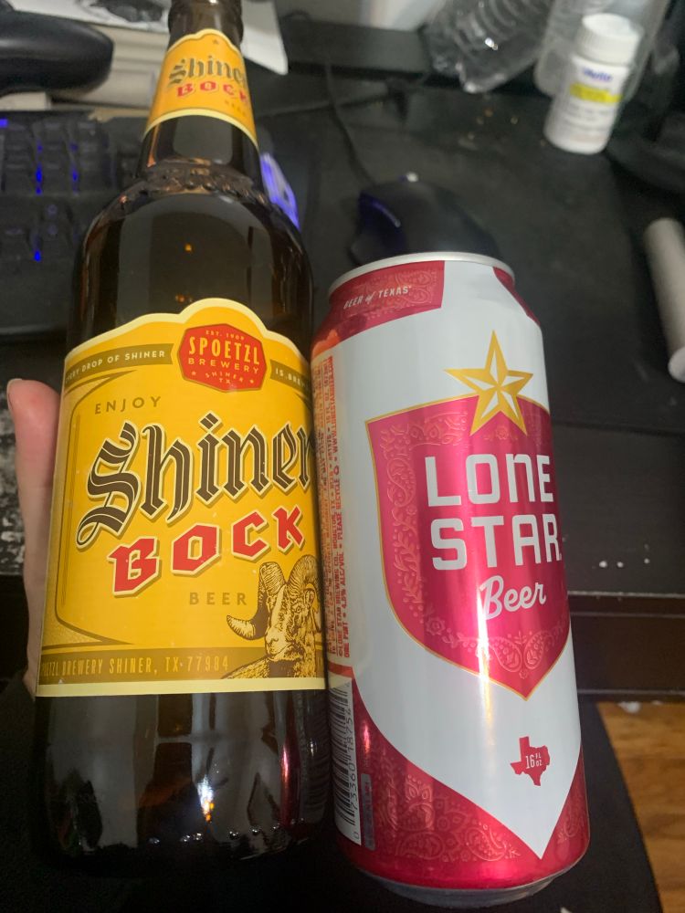 A pint bottle of Shiner Bock beer and a tall boy can of Lone Star beer