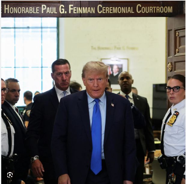 Donald J. Trump exits the Paul. G. Feinman courtroom during his fraud trial.