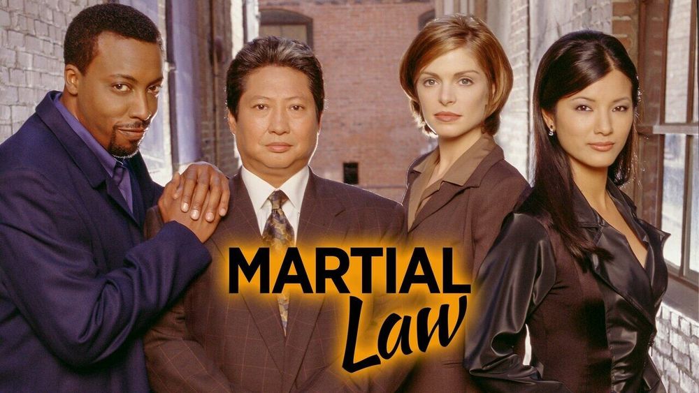 Photo by Joshua Mensah on August 11, 2025. May be an image of 3 people, poster and text that says 'MARTIAL Law'.