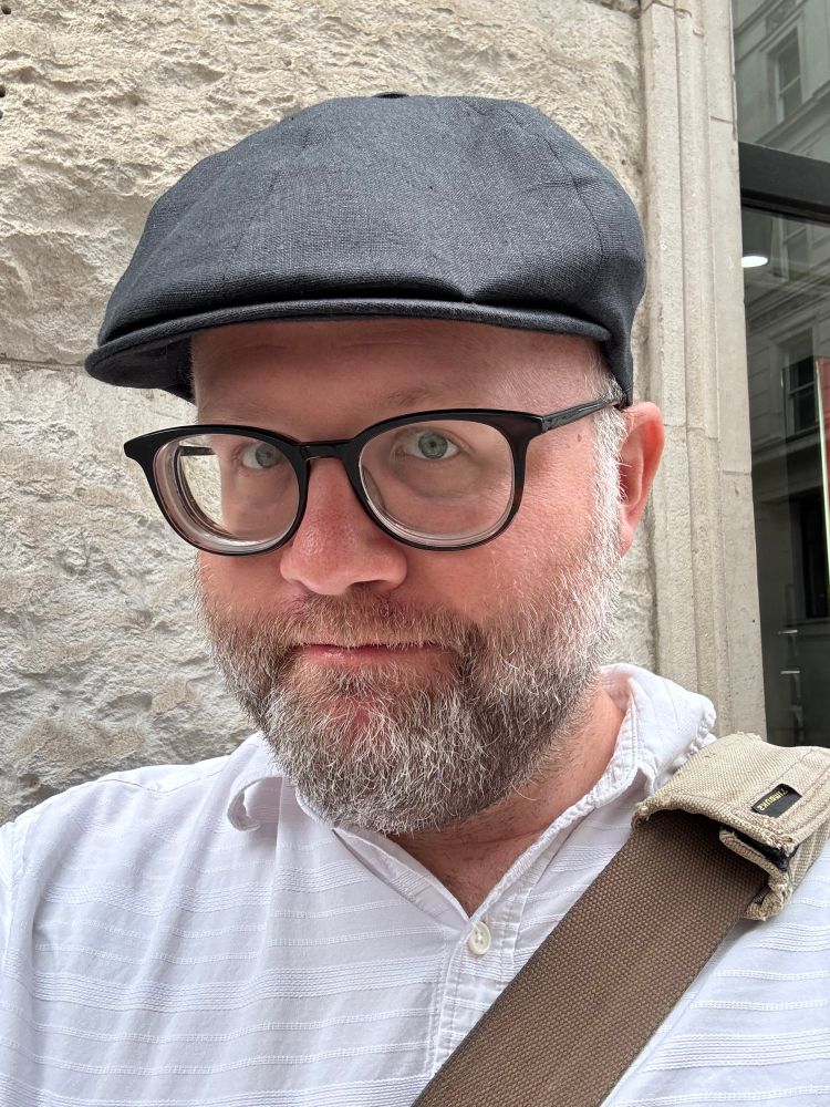 Shane wearing a new flat cap