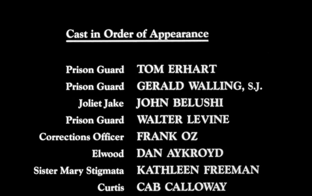 start of the cast list for The Blues Brothers (1980) with the second entry being "Prison Guard: Gerald Walling, S.J."