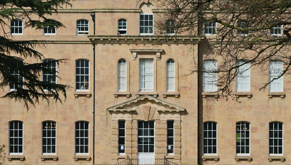 South-Eastward facing frontage, cropped to just windows and door.