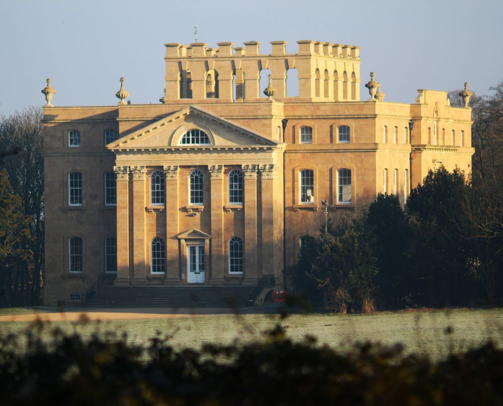 House from front left quarter, sunlit in early morning.