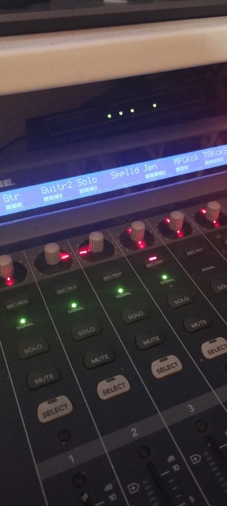 A control panel with buttons and an pcs showing track names like "guitar" and "sample"