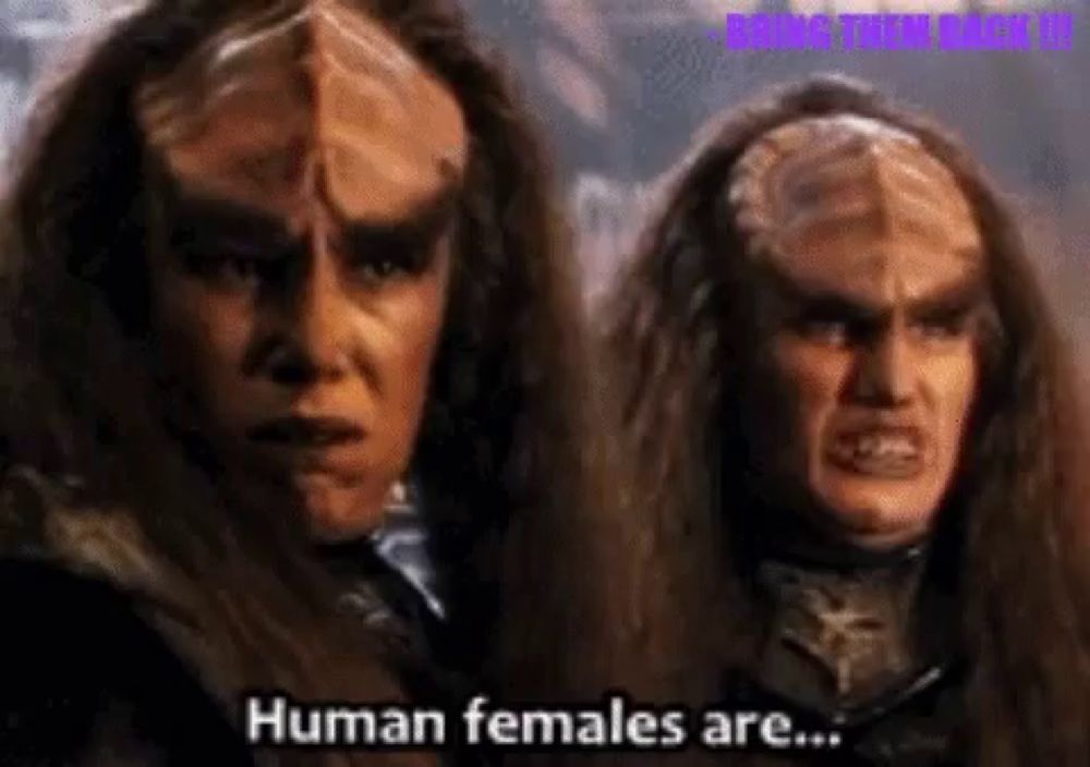 a couple of aliens are standing next to each other and one says human females are