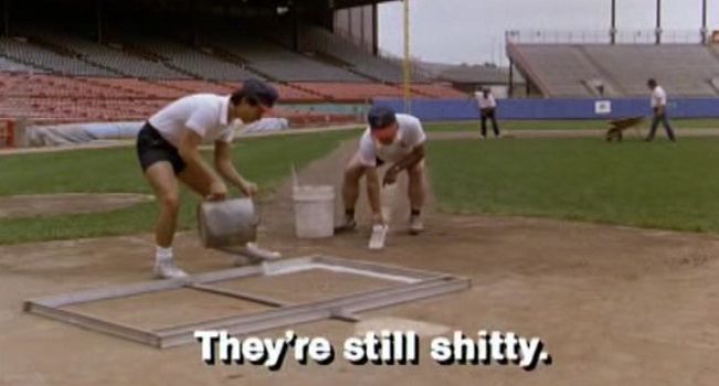 Two baseball groundskeepers saying “they’re still shitty”