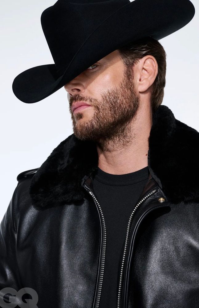 Jensen Ackles in a black leather jacket, black tshirt, and black cowboy hat. From GQ magazine.