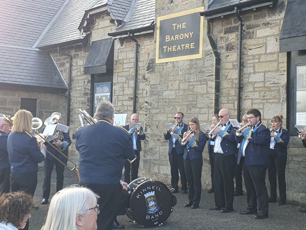 The Kinneil brass band playing outside the Barony Theatre in Boness. 