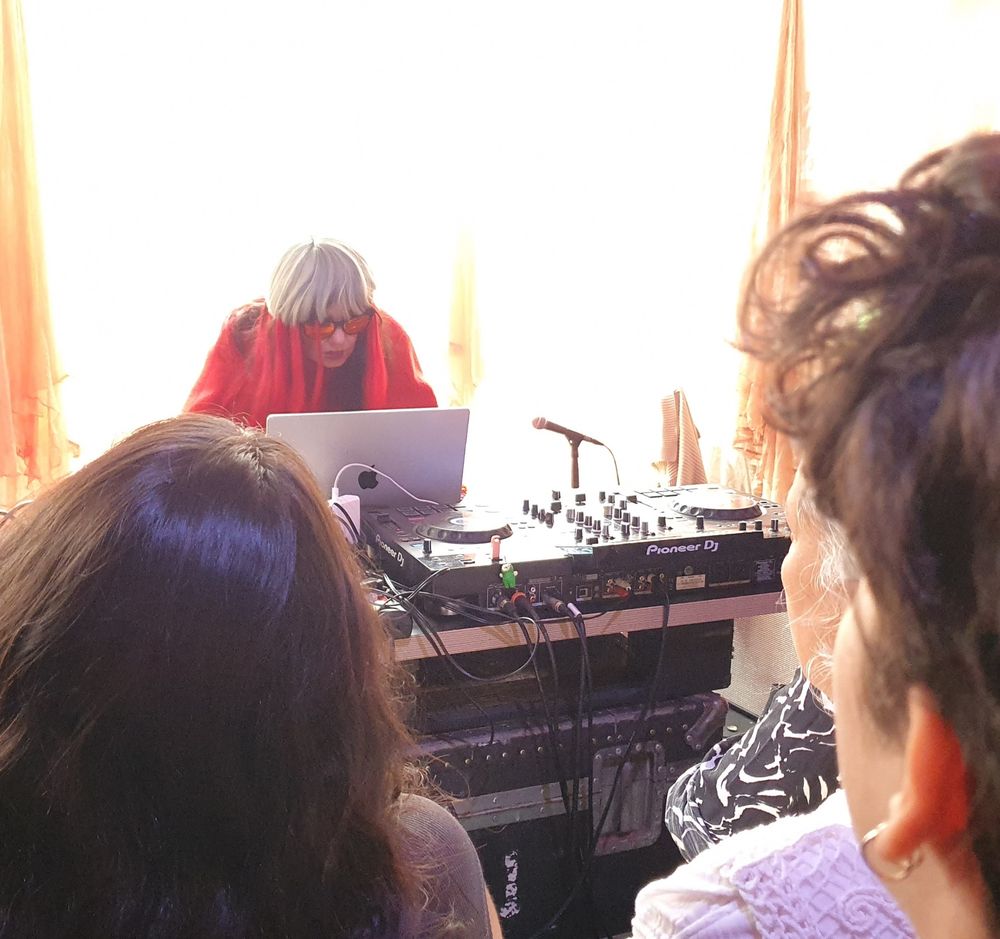 Bjork hunched intently over a laptop at a mixing desk a small audience watching from a few feet away.