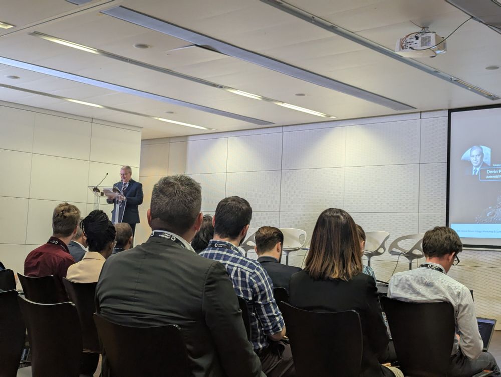 Audience watching as Romanian Cosmonaut Dorin Prunario introduces a panel at the Moon Village Association workshop. 