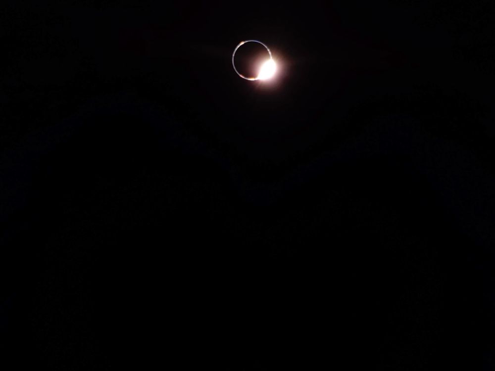 Image of the Earth and Sun during a lunar eclipse, taken by the Blue Ghost lander from the lunar surface. Most of the image is black, and the Earth blocks all but a beautiful ring of the Sun's light.