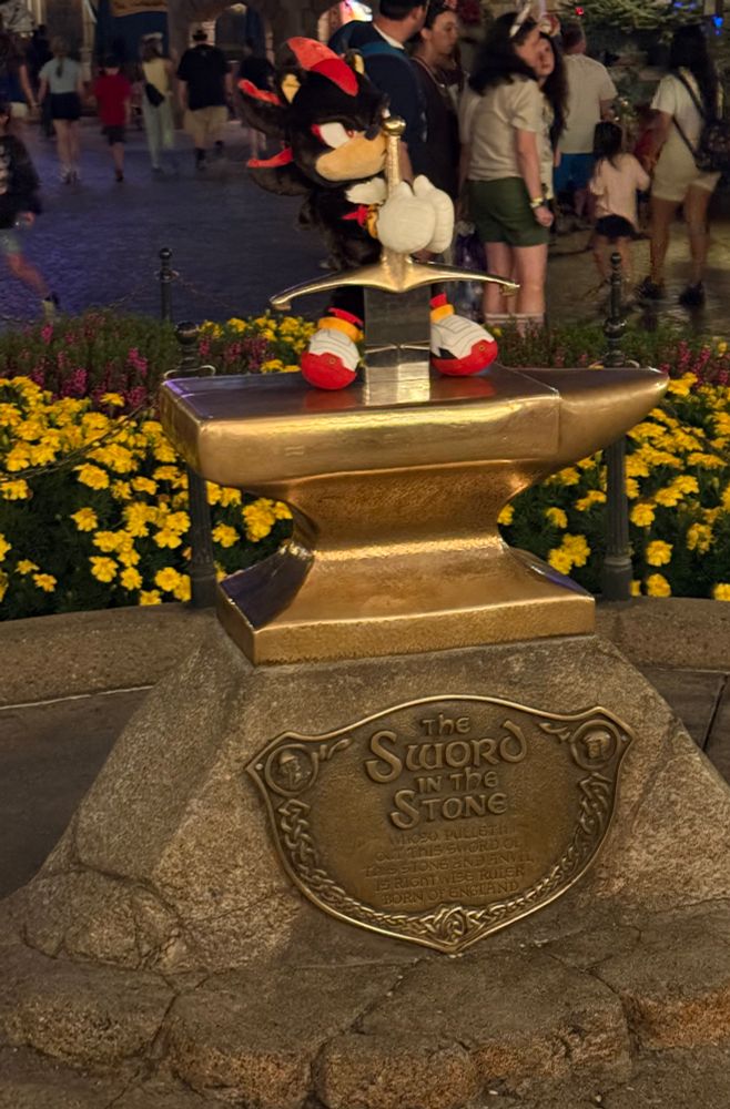 Shadow build a bear trying to pull the sword out of the stone at Disneyland 