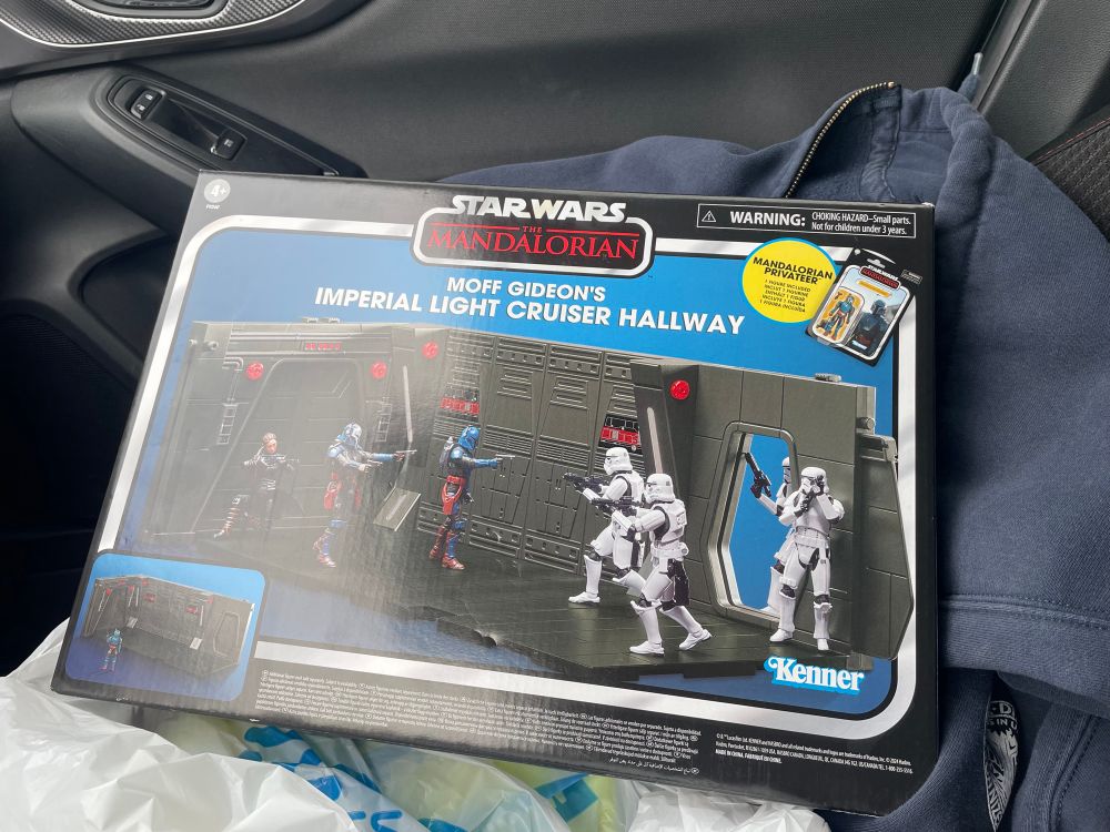 A vintage style box set of "moff Gideon's imperial light cruiser hallway". It's got a picture of a rectangular star wars diorama with two walls, two doors, and 6 various figures. 