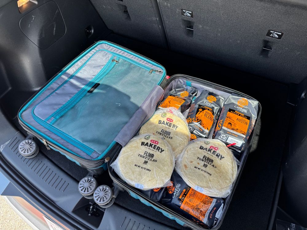 Suitcase full of H-E-B tortillas and coffee