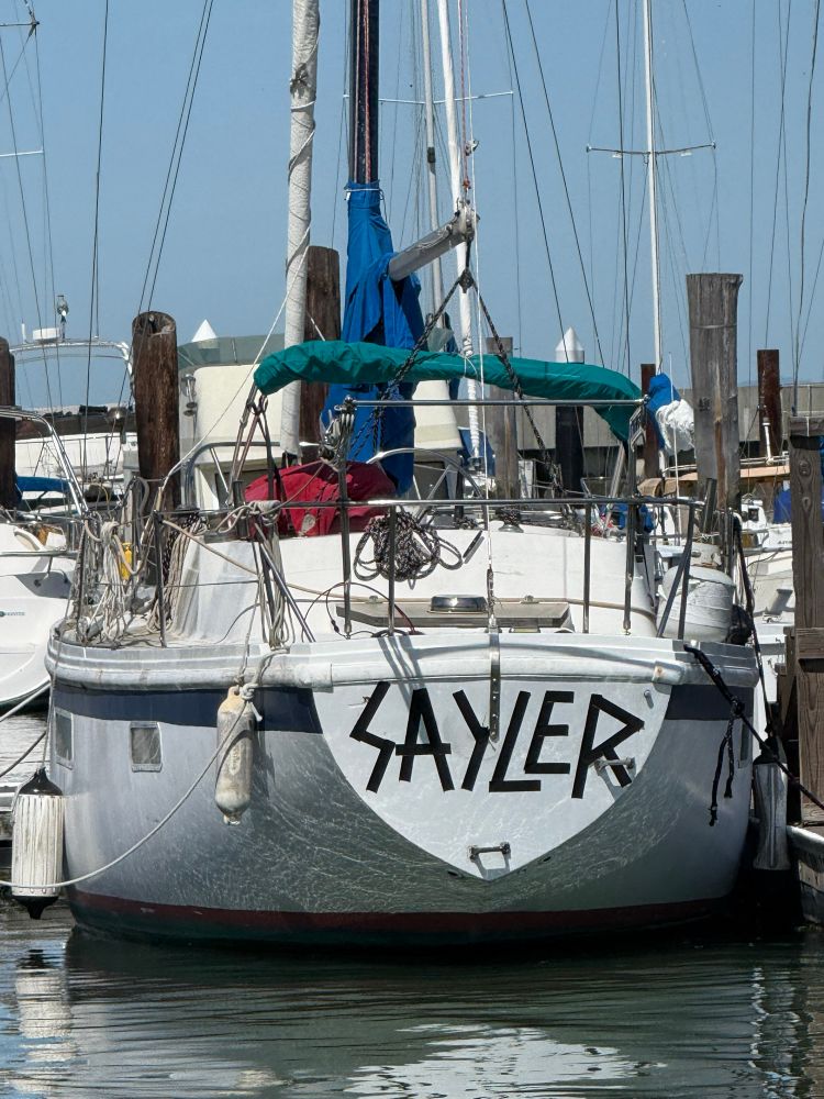 Boat named Sayler in the old school Slayer font