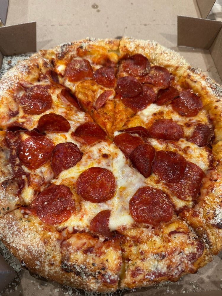 An ooey, gooey, pepperonis pizza with parm sprinkled on the crust. 