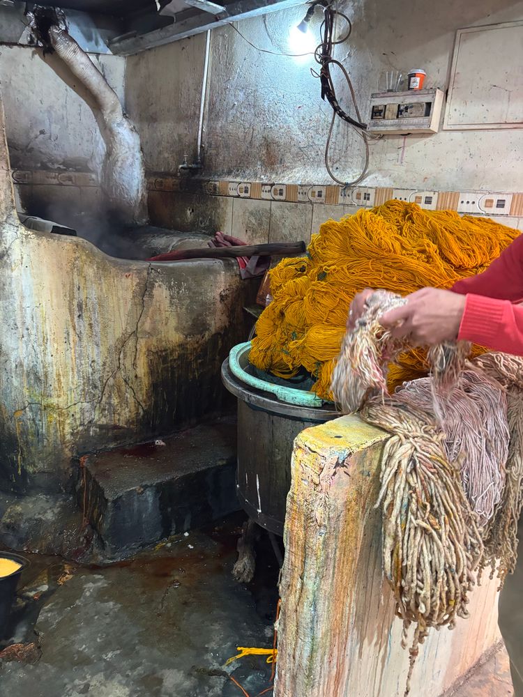 Large skeins of yarn dyed in large cauldron in the souk