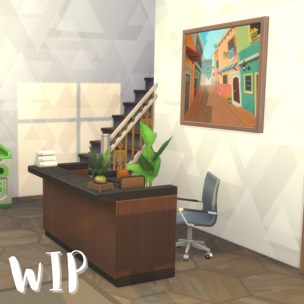 screenshot of the sims 4 of the entrance to a rec center. a colorful painting is on the wall behind a reception desk which has small towels on it as well as a computer and small plant. the chair for the desk is slightly askew, and a plant is behind the desk as are a set of stairs. in the bottom left corner is the acronym "WIP"