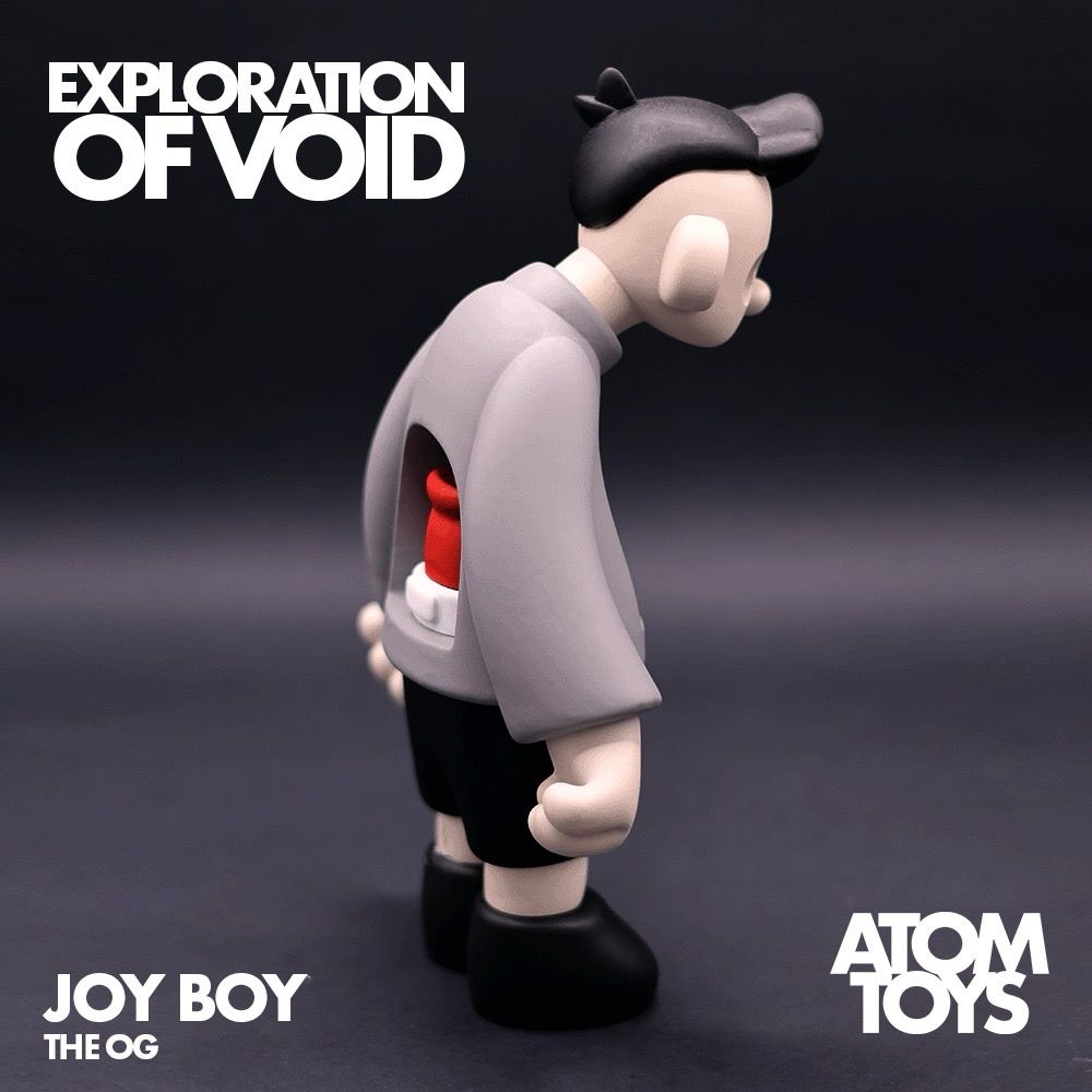 Back view of Joy Boy, the OG designer art toy, showcasing its intricate details. The collectible is displayed alongside its custom-designed box and certificate of authenticity, emphasizing its limited-edition 