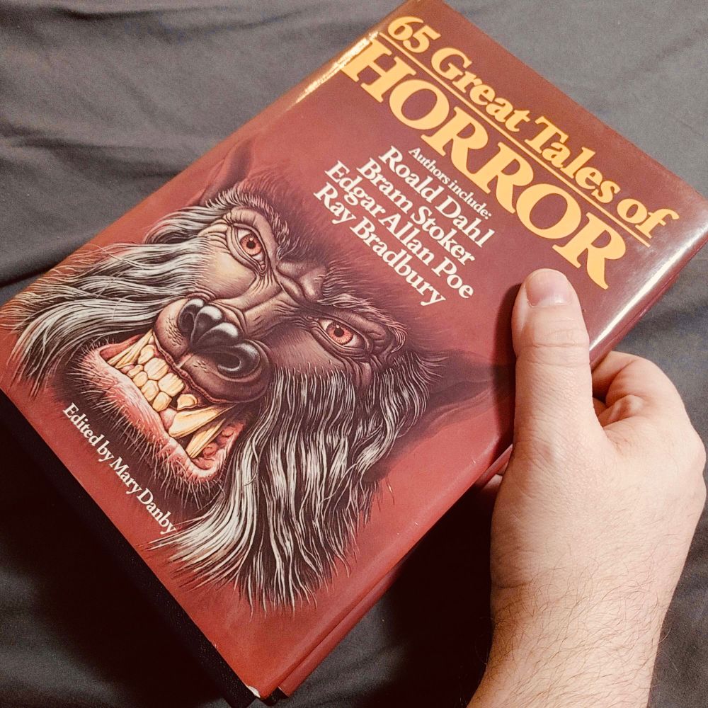 A horror anthology book titled: 65 Great Tales of Horror. Authors including- Roald Dahl, Bram Stoker, Edgar Allan Poe, and Ray Bradbury.