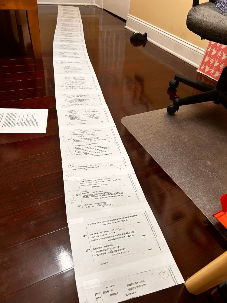 Long taped together scroll of documents on floor