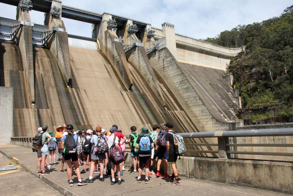 A group of primary school students visiting Warragamba Dam, being guided by Kelly Osterberg. 