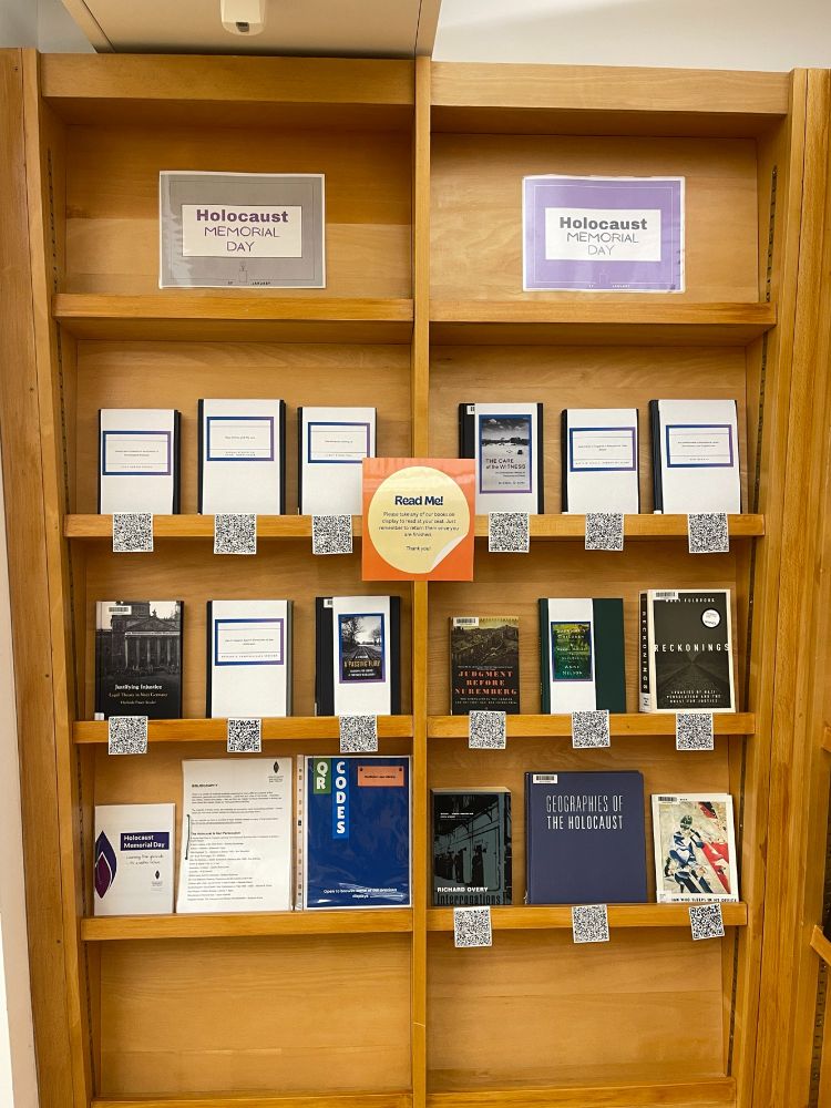 Books displayed on shelves for Holocaust Memorial Day.