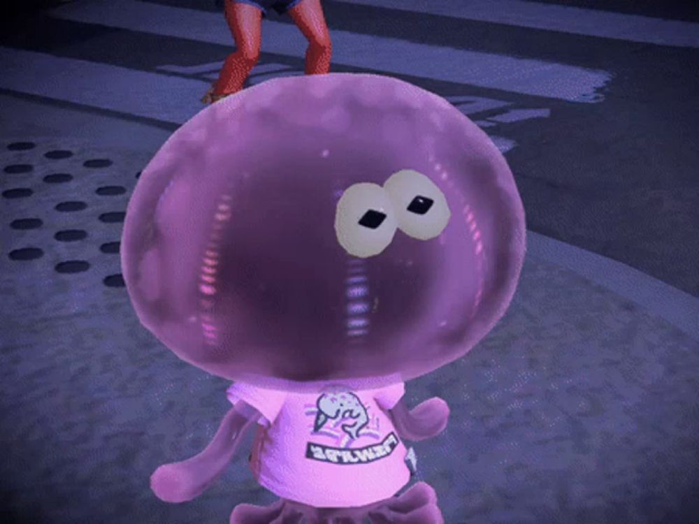 a purple jellyfish wearing a pink shirt that says denial on it