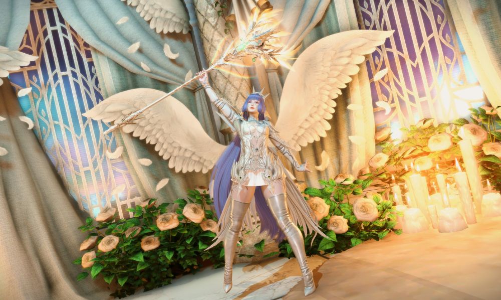 Anzu standing in a room decorated with white roses, angels wings, pillars and white drapery. She is smiling while holding the Nirvana Zeta ARR WHM relic above her head.