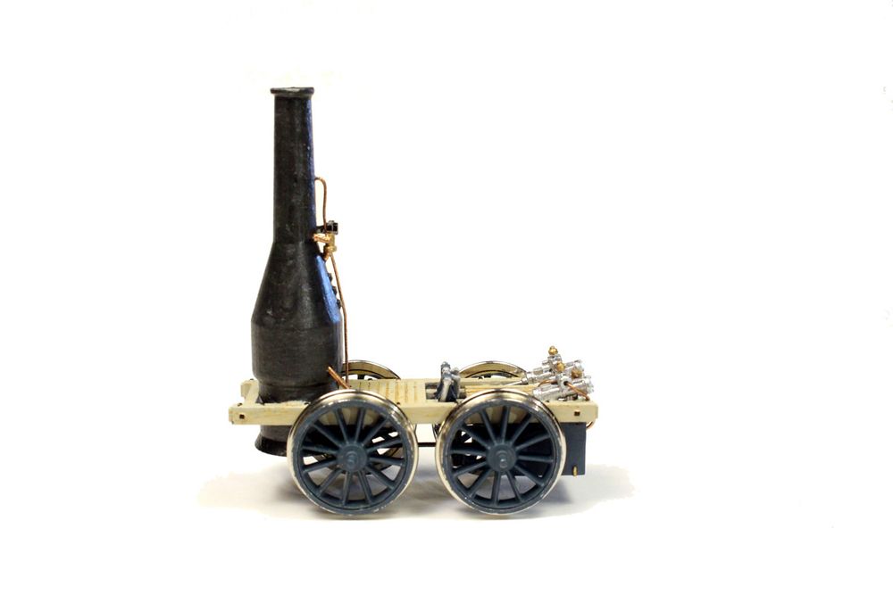 photo, profile view of an HO scale model of the 1830 locomotive Best Friend, which was built by the West Point Foundry for the South Carolina Canal and Rail Road Company. Built in the spring of 1830, it entered regular service in December 1830.