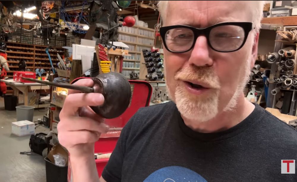 still of Adam Savage holding an oil can 