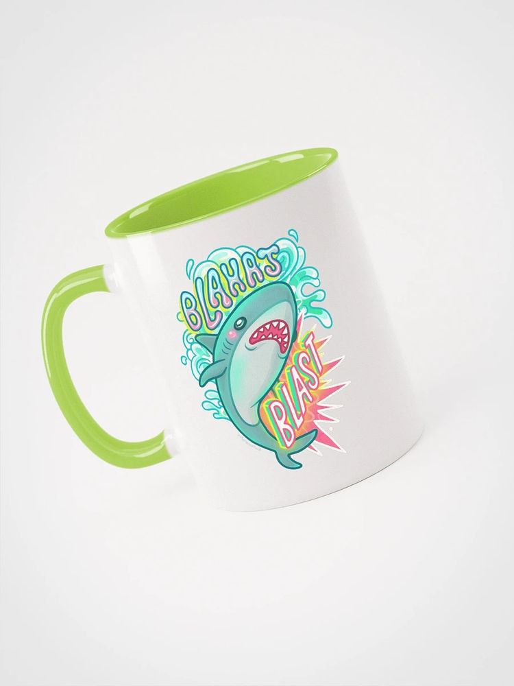 "blahaj blast" design shown on a mug with a green handle and inside