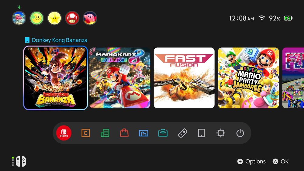 The Nintendo Switch 2 home menu with Donkey Kong Bananza highlighted, followed by Mario Kart 8 Deluxe, Fast Fusion, Super Mario Party Jamboree, and F-Zero 99.