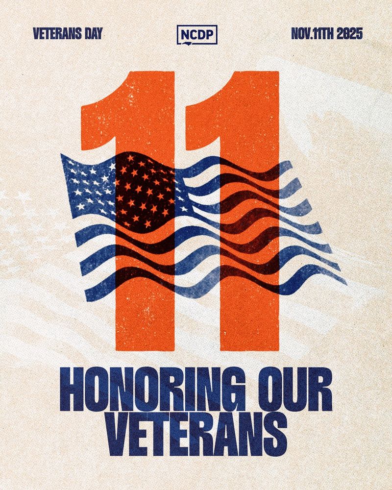 A red number 11 on a beige background with a blue American flag over the top. Honoring our veterans. 