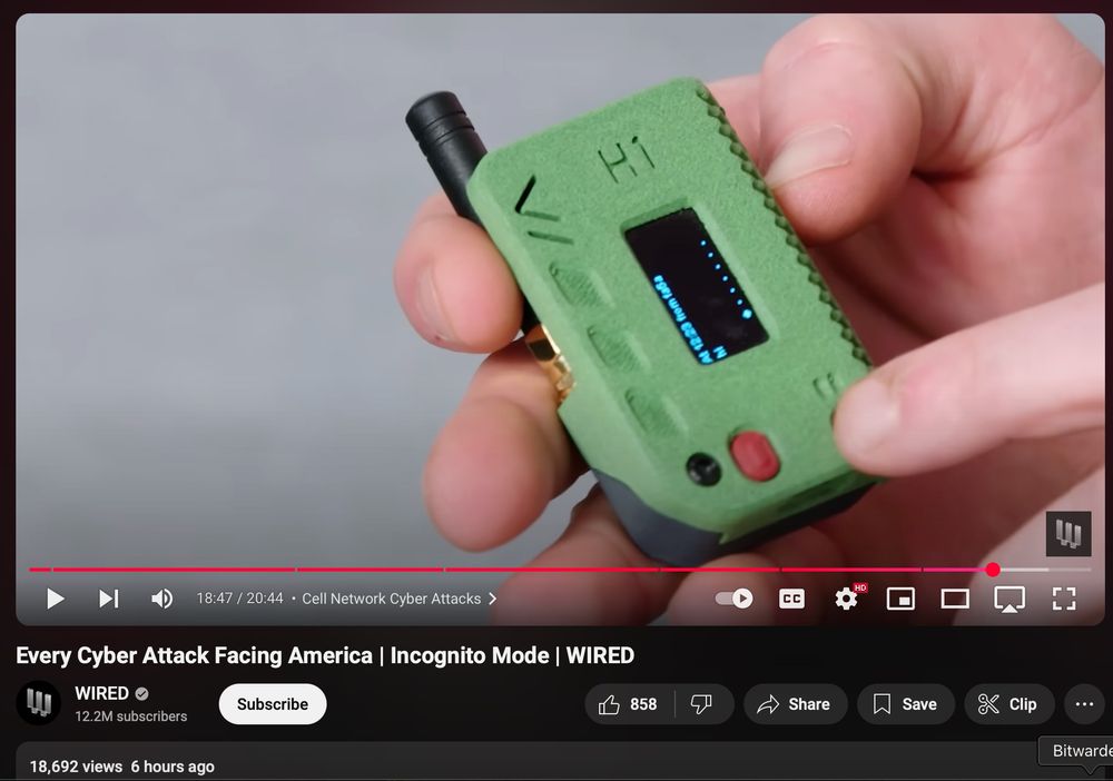 Screenshot of a YouTube video showcasing a meshtastic device in a green 3D printed case. Title of the video is "Every Cyber Attack Facing America | Incognito Mode | WIRED", various YouTube controls and UI. 