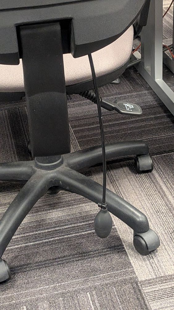 Squeezy air blower thing that inflates back support on office chairs