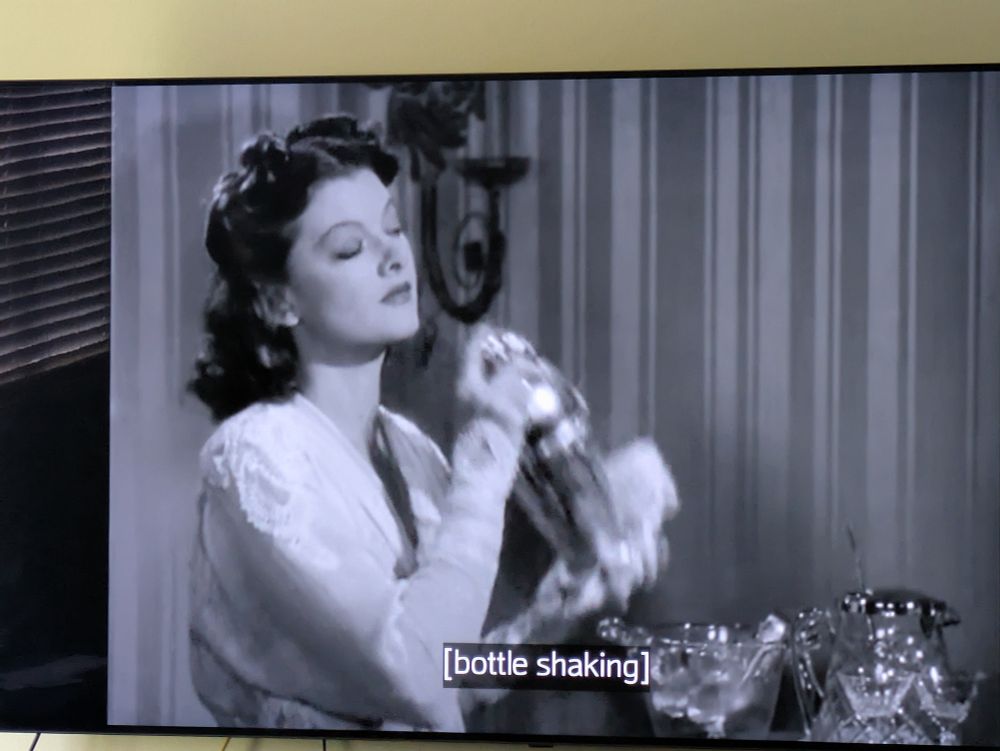 Smash cut to his wife Nora shaking a cocktail shaker presumably full of ice and vodka. 