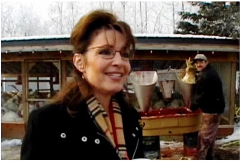Sarah Palin getting in front of a guy decapitating a thanksgiving turkey