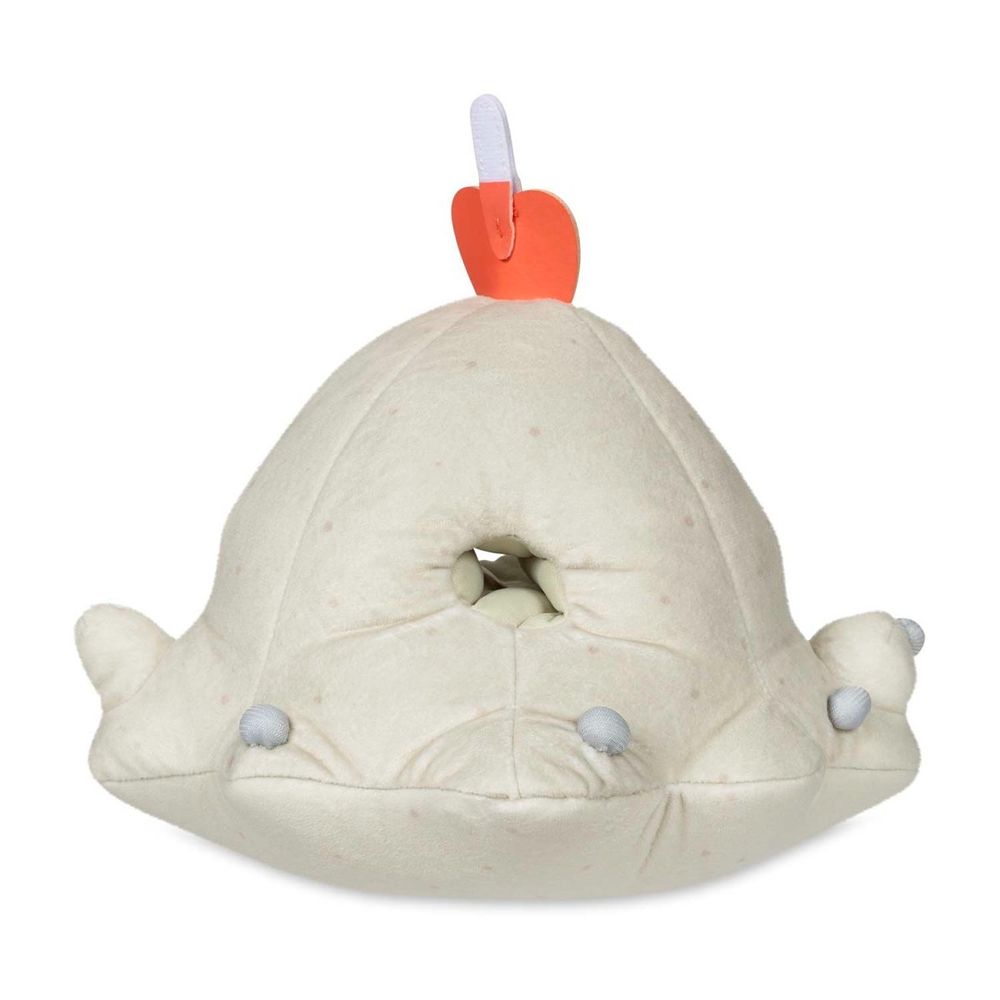 Backside of a Pokémon Sandygast plush toy. There's a sewn hole in the middle. 