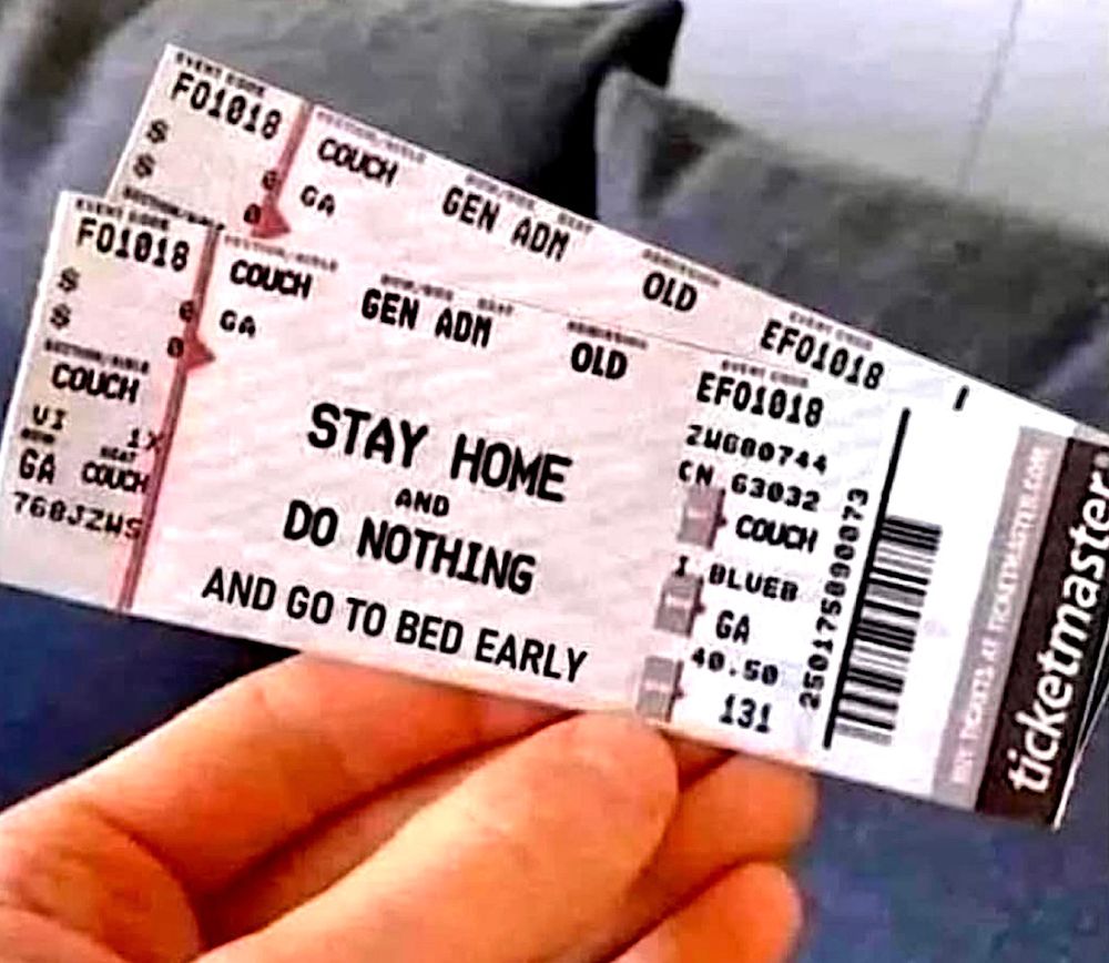 Hand holding two tickets that look official, title of event: Stay Home and Do Nothing and go to bed early.