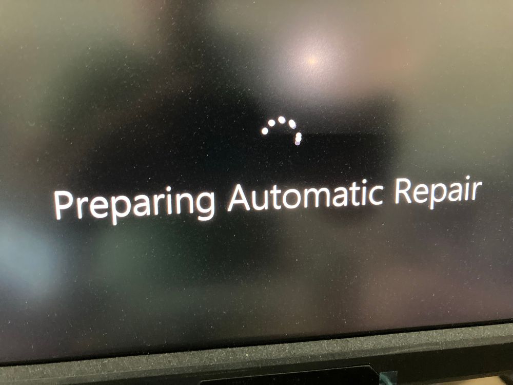 Windows boot screen with the text “Preparing Automatic Repair”.