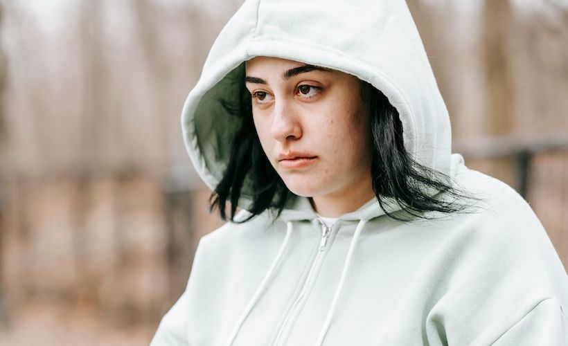 Gen Z Stare? Young Woman Looking Wistfully at House She’ll Never Be Able to Afford